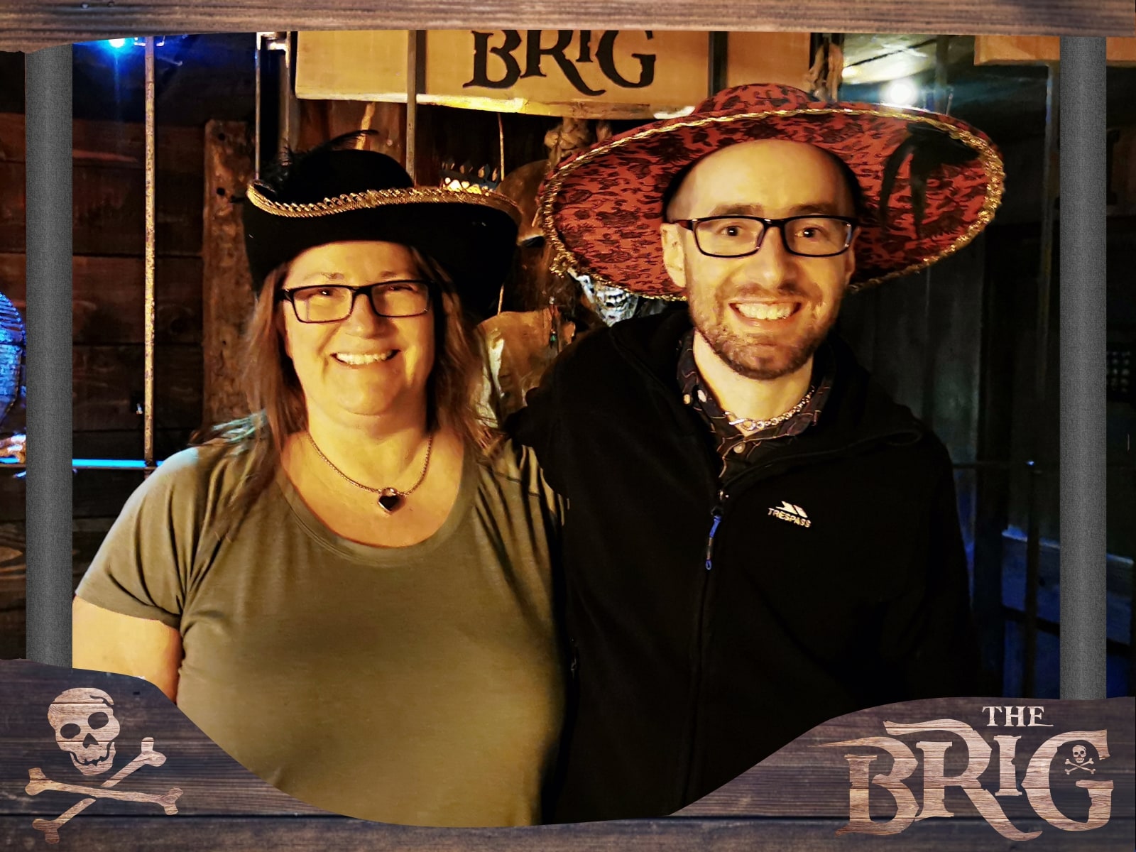 Anthony and Trenna pose after The Brig at Live Escape Salisbury, wearing pirate hats in the wooden brig set.
