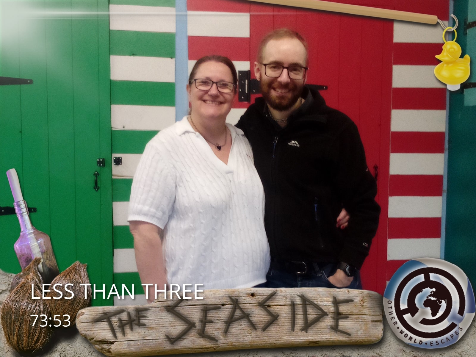 Anthony and Trenna pose after The Seaside at Other World Escapes, before striped seaside doors.